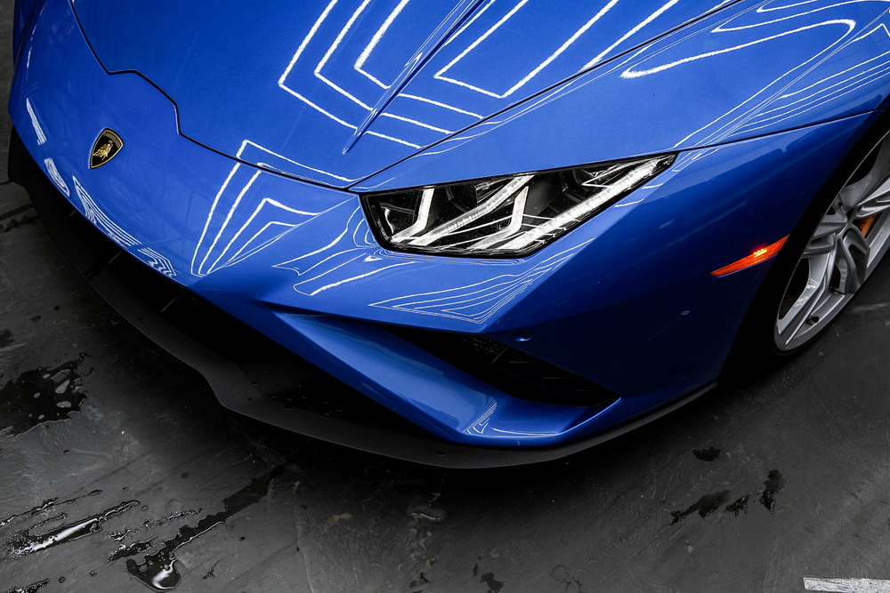Vehicle with freshly applied ceramic coating and mirror-like shine.